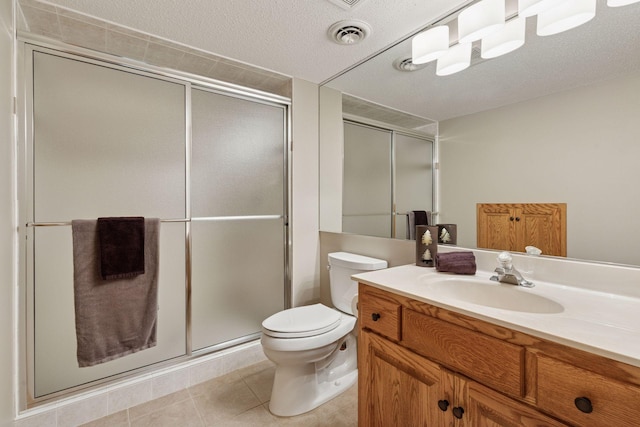 18172 Tamarack Dr, Minnetonka, MN 55345 - full bathroom with vanity, a shower stall, tile patterned floors, and toilet