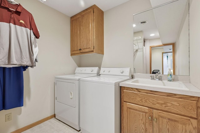 18172 Tamarack Dr, Minnetonka, MN 55345 - washroom with separate washer and dryer, cabinet space, and baseboards