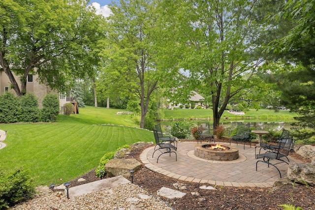 18172 Tamarack Dr, Minnetonka, MN 55345 - view of green lawn featuring a fire pit and a patio