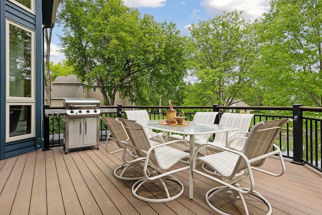 18172 Tamarack Dr, Minnetonka, MN 55345 - deck featuring outdoor dining area, grilling area, and view of scattered trees