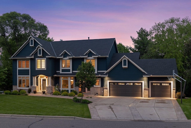 18172 Tamarack Dr, Minnetonka, MN 55345 - craftsman inspired home with an attached garage, concrete driveway, a front lawn, and stone siding