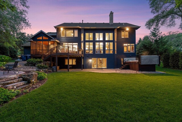 18172 Tamarack Dr, Minnetonka, MN 55345 - rear view of property with a patio, a sunroom, a hot tub, and stairs