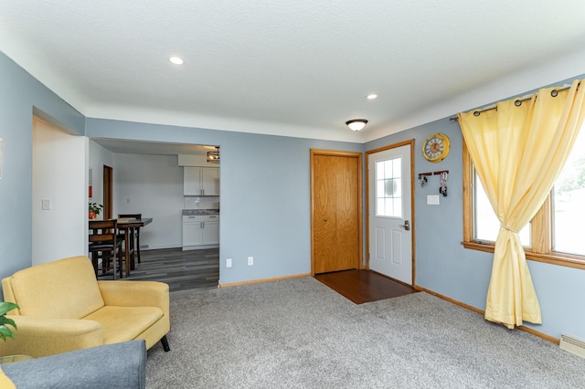 311 Wisconsin St, Lake City, MN 55041 - entryway with dark carpet, baseboards, and recessed lighting