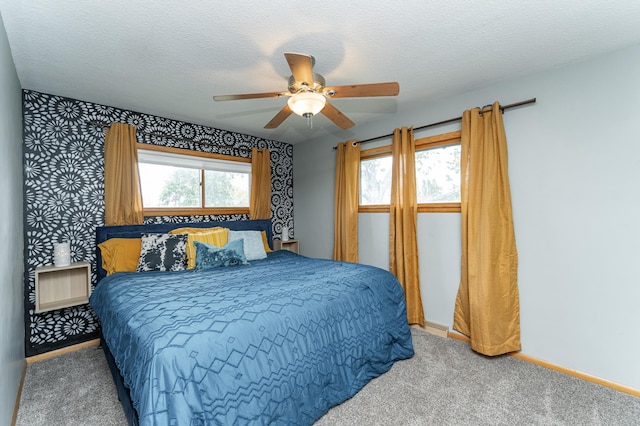311 Wisconsin St, Lake City, MN 55041 - carpeted bedroom featuring wallpapered walls, baseboards, ceiling fan, and a textured ceiling