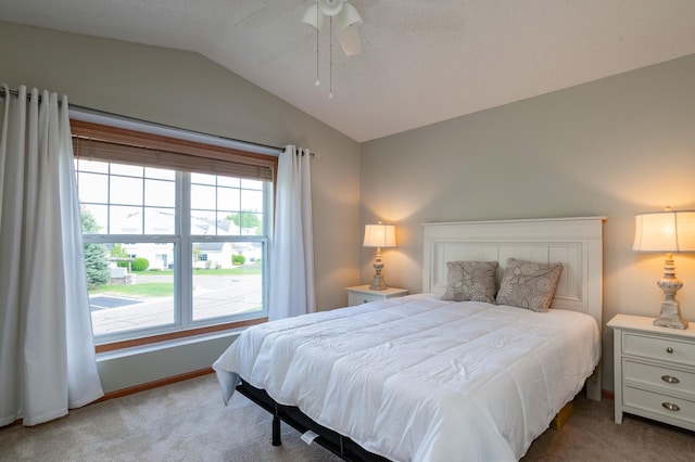 4960 149th St N Unit 6, Hugo, MN 55038 - bedroom with light carpet, vaulted ceiling, baseboards, and a ceiling fan