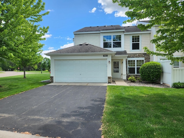 4960 149th St N Unit 6, Hugo, MN 55038 - traditional-style house featuring stone siding, driveway, a garage, a front lawn, and a shingled roof