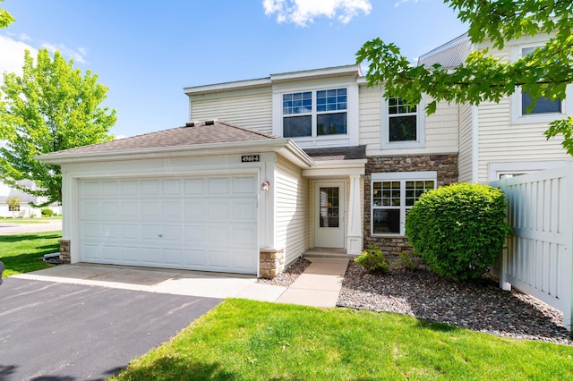 4960 149th St N Unit 6, Hugo, MN 55038 - view of front facade with stone siding, asphalt driveway, and an attached garage