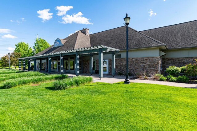 4960 149th St N Unit 6, Hugo, MN 55038 - back of house featuring a pergola, a yard, and a shingled roof
