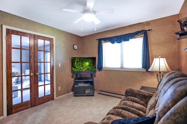 1825 Perlich Ave Unit 206, Red Wing, MN 55066 - living room with a baseboard heating unit, french doors, carpet floors, ceiling fan, and a textured ceiling