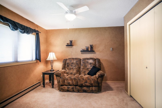 1825 Perlich Ave Unit 206, Red Wing, MN 55066 - living area with a baseboard heating unit, ceiling fan, and carpet floors