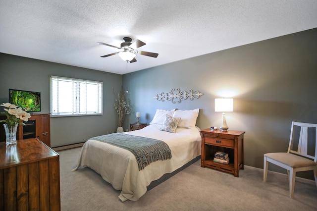 1825 Perlich Ave Unit 206, Red Wing, MN 55066 - bedroom featuring a baseboard heating unit, carpet, a textured ceiling, and a ceiling fan