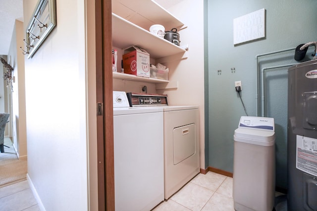 1825 Perlich Ave Unit 206, Red Wing, MN 55066 - laundry area featuring separate washer and dryer, light tile patterned floors, water heater, and baseboards