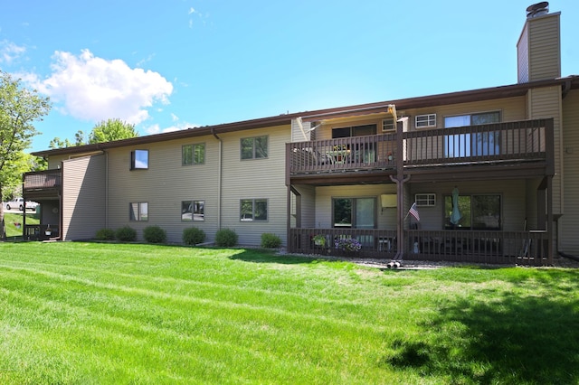 1825 Perlich Ave Unit 206, Red Wing, MN 55066 - back of house featuring a chimney, a balcony, and a yard