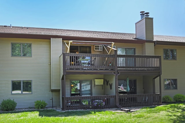 1825 Perlich Ave Unit 206, Red Wing, MN 55066 - rear view of property with a balcony, a chimney, and a yard