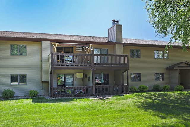 1825 Perlich Ave Unit 206, Red Wing, MN 55066 - back of property featuring a balcony, a lawn, and a chimney