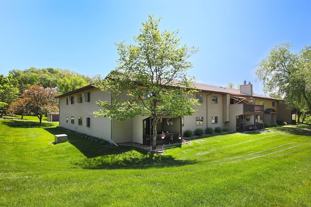 1825 Perlich Ave Unit 206, Red Wing, MN 55066 - rear view of house with a chimney and a yard