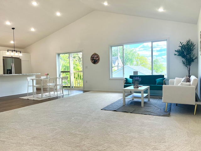 826 Sims Ave, Saint Paul, MN 55106 - living area with recessed lighting, high vaulted ceiling, dark colored carpet, and baseboards