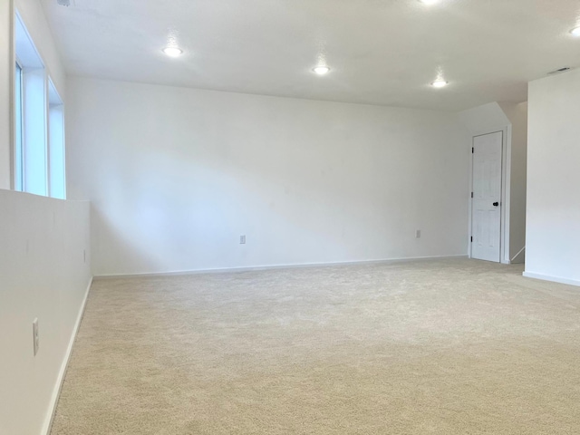 826 Sims Ave, Saint Paul, MN 55106 - spare room with light colored carpet, baseboards, and recessed lighting