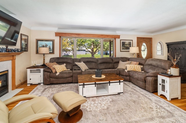 721 Maple Dr, Aurora, MN 55705 - living room featuring a fireplace and wood finished floors