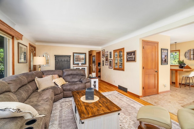 721 Maple Dr, Aurora, MN 55705 - living room featuring light wood finished floors and baseboards