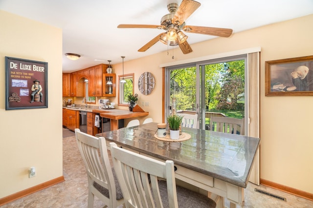 721 Maple Dr, Aurora, MN 55705 - dining space with a ceiling fan and baseboards