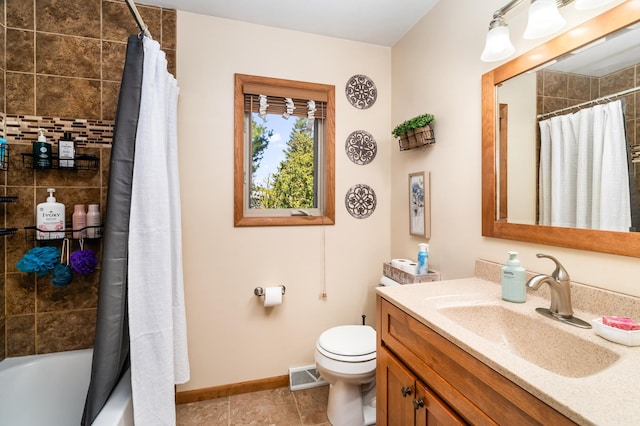 721 Maple Dr, Aurora, MN 55705 - full bathroom with vanity, toilet, baseboards, tile patterned floors, and shower / tub combo