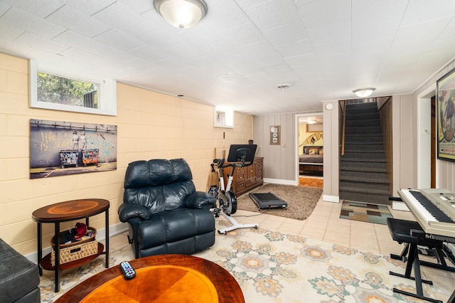 721 Maple Dr, Aurora, MN 55705 - living area with stairway and tile patterned flooring