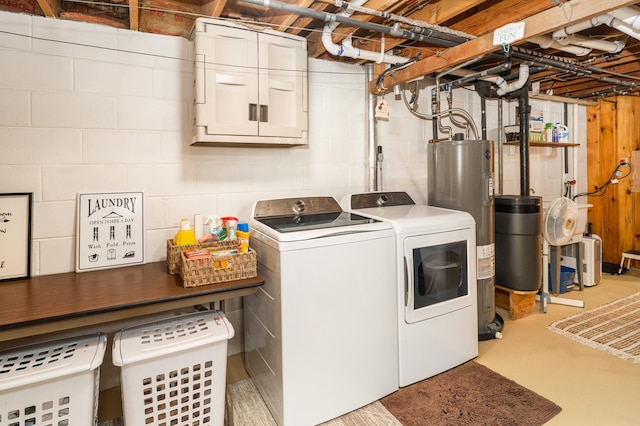 721 Maple Dr, Aurora, MN 55705 - laundry room featuring washing machine and dryer, electric water heater, and concrete block wall