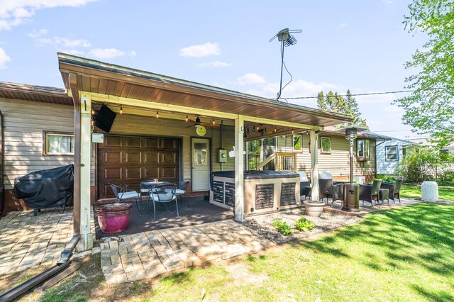 721 Maple Dr, Aurora, MN 55705 - back of property featuring a patio, a yard, and a ceiling fan