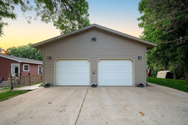 614 S Shore Dr S, Windom, MN 56101 - garage at dusk with a garage