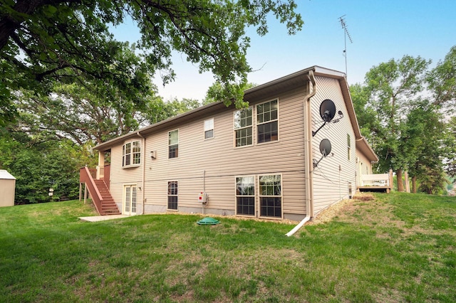 614 S Shore Dr S, Windom, MN 56101 - rear view of house with stairway, a lawn, and a wooden deck
