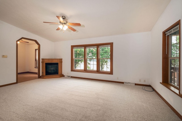 614 S Shore Dr S, Windom, MN 56101 - unfurnished living room featuring carpet flooring, baseboards, a ceiling fan, and arched walkways