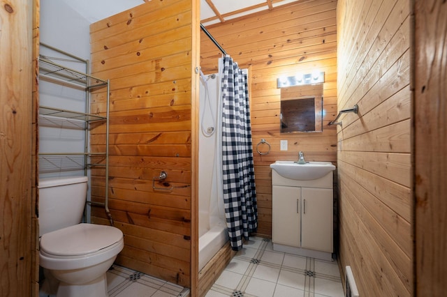 614 S Shore Dr S, Windom, MN 56101 - bathroom featuring wooden walls, toilet, tile patterned floors, vanity, and shower / tub combo with curtain