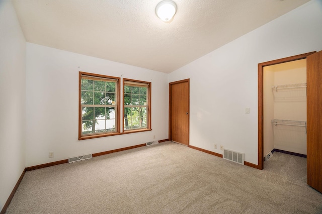 614 S Shore Dr S, Windom, MN 56101 - unfurnished room with carpet flooring, baseboards, and lofted ceiling