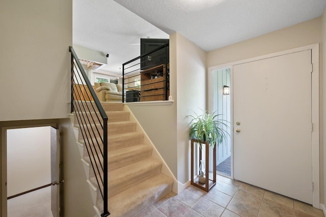 17915 17th Ave N, Plymouth, MN 55447 - foyer featuring stairs, baseboards, and a textured ceiling