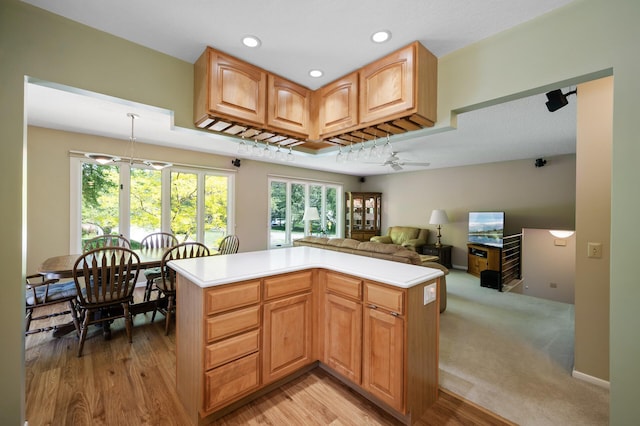 17915 17th Ave N, Plymouth, MN 55447 - kitchen featuring light countertops, a ceiling fan, recessed lighting, open floor plan, and light wood-type flooring