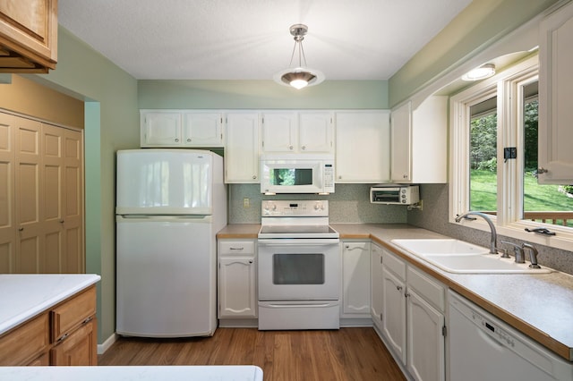 17915 17th Ave N, Plymouth, MN 55447 - kitchen featuring white appliances, a sink, wood finished floors, and tasteful backsplash