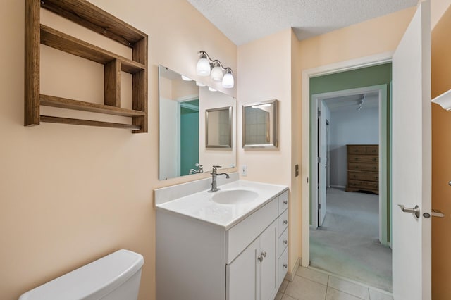 17915 17th Ave N, Plymouth, MN 55447 - half bath featuring toilet, vanity, tile patterned floors, and a textured ceiling