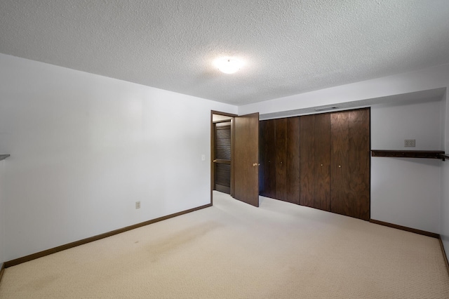 17915 17th Ave N, Plymouth, MN 55447 - unfurnished bedroom featuring carpet, a closet, baseboards, and a textured ceiling
