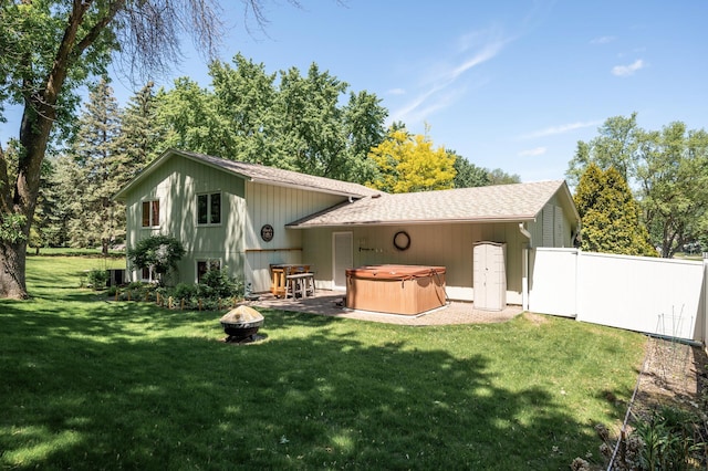 17915 17th Ave N, Plymouth, MN 55447 - rear view of house featuring a hot tub, an outdoor fire pit, and roof with shingles