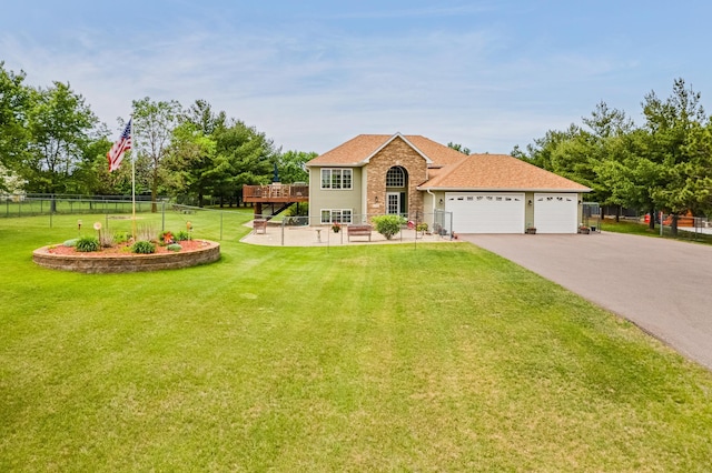 28610 Bay Shore Dr NW, Isanti, MN 55040 - split foyer home featuring an attached garage, asphalt driveway, and a wooden deck
