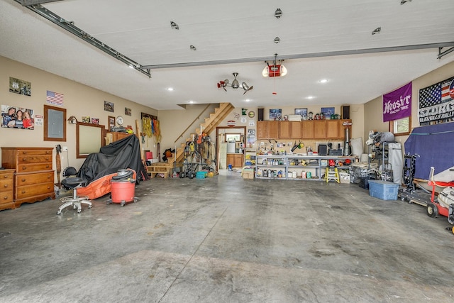 28610 Bay Shore Dr NW, Isanti, MN 55040 - garage featuring electric panel, recessed lighting, and a garage door opener
