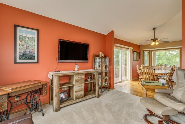 28610 Bay Shore Dr NW, Isanti, MN 55040 - carpeted living room featuring ceiling fan and baseboards