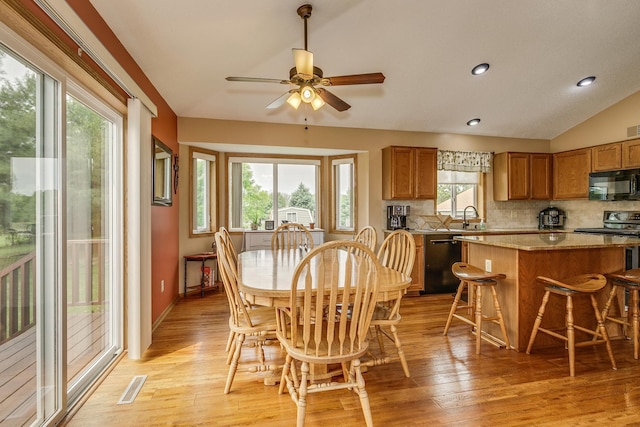 28610 Bay Shore Dr NW, Isanti, MN 55040 - dining space featuring a ceiling fan, light wood finished floors, recessed lighting, and lofted ceiling