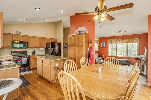 28610 Bay Shore Dr NW, Isanti, MN 55040 - dining room featuring ceiling fan, light wood finished floors, and high vaulted ceiling