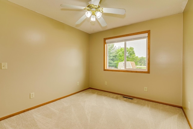 28610 Bay Shore Dr NW, Isanti, MN 55040 - carpeted empty room with baseboards and a ceiling fan