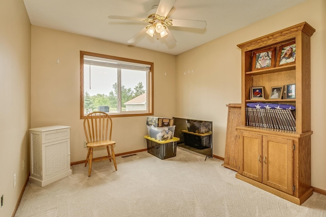 28610 Bay Shore Dr NW, Isanti, MN 55040 - living area with light carpet, ceiling fan, and baseboards