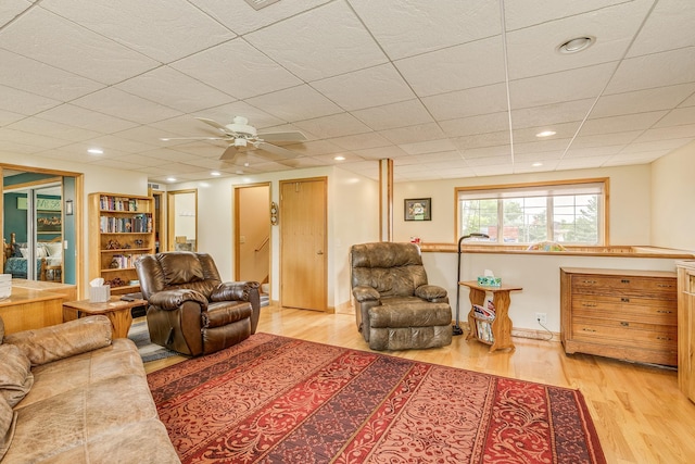28610 Bay Shore Dr NW, Isanti, MN 55040 - living room featuring wood finished floors, ceiling fan, recessed lighting, and a drop ceiling