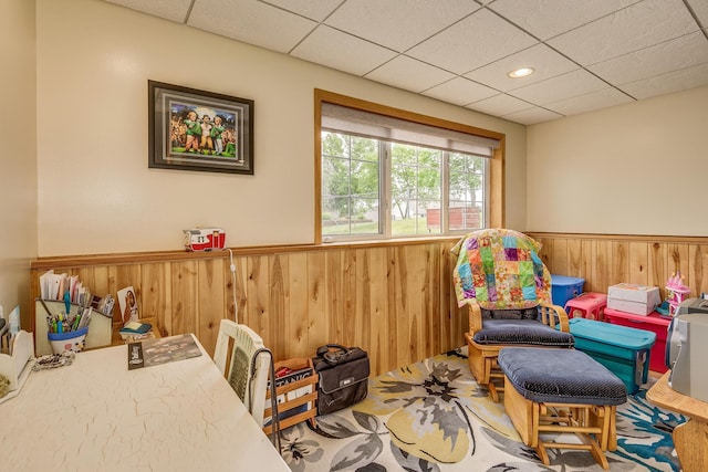 28610 Bay Shore Dr NW, Isanti, MN 55040 - recreation room featuring a wainscoted wall, a drop ceiling, and wooden walls