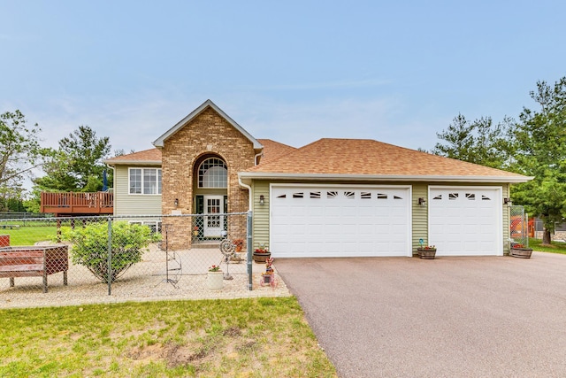 28610 Bay Shore Dr NW, Isanti, MN 55040 - view of front facade with asphalt driveway, an attached garage, roof with shingles, and brick siding